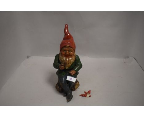 A 20th century German hand painted ceramic garden gnome figure