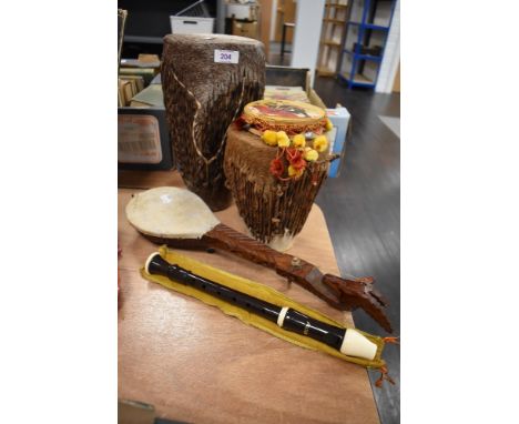 20th century tribal animal skin drums with recorder and small guitar
