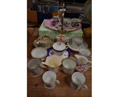 A collection of decorative vintage and antique cups and jugs, also included is a handled cake plate having pink ground with f
