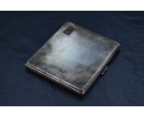 A Queen Elizabeth II silver cigarette case, of hinged rectangular form, engine-turned throughout, marks for Birmingham 1953, 