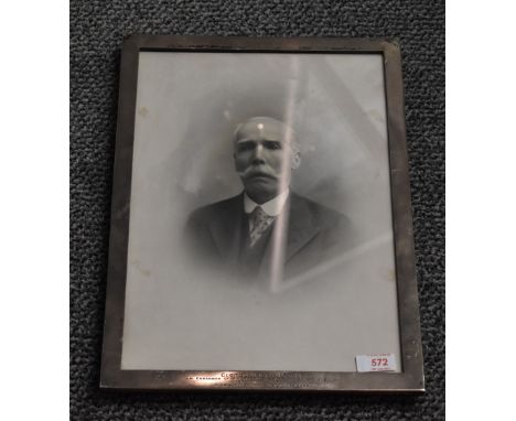 A large George V Silver photograph frame, of plain rectangular form with engraved presentation inscription to base 'George H 