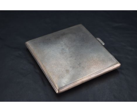 A 1930's silver cigarette case, of hinged rectangular form, engine-turned throughout, marks for Birmingham 1938, maker John R