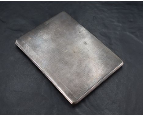 A George V silver cigarette case, of piano-hinged rectangular form with subtle engine-turned surface decoration, the gilt int