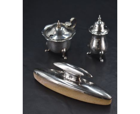 A George V silver two-piece condiment set, comprising pepperette and mustard, marks for London 1928, maker Robert Pringle &am