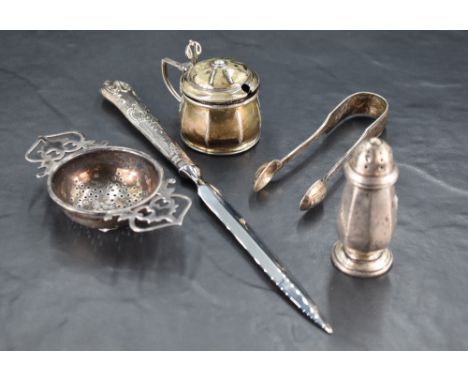 A George V silver tea strainer, of pierced circular form with ornate pierced handles, marks for Birmingham 1935, maker Lanson