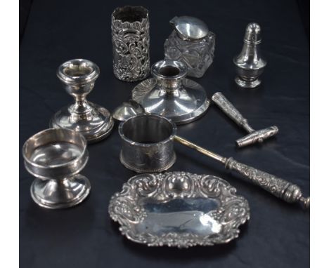 A selection of mixed silver and white metal items, to include pepperette, squat candlestick, napkin ring, inkwell, small silv