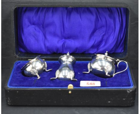 A George VI silver three-piece condiment set, comprising pepperette, salt and mustard, the latter two with Bristol Blue glass