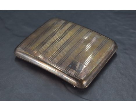 A George VI silver cigarette case, of hinged rectangular form and curved for the gentleman's pocket, engine-turned with repea