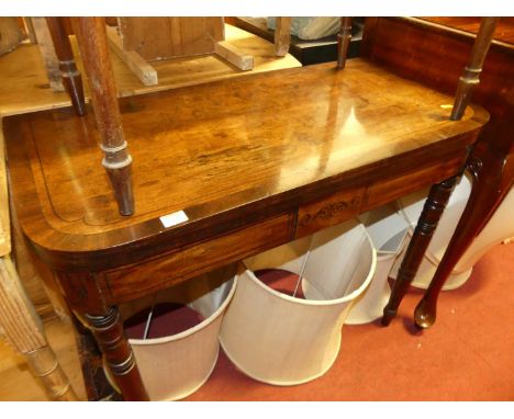 An early 19th century mahogany and cross banded D-end fold-over card table, raised on ring turned supports, width 88cmConditi