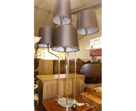 A contemporary chromed metal five branch table light of good size with original shades