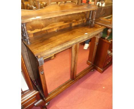 An early Victorian rosewood chiffonier, the raised superstructure over twin mirrored doors on flattened bun supports, width 1