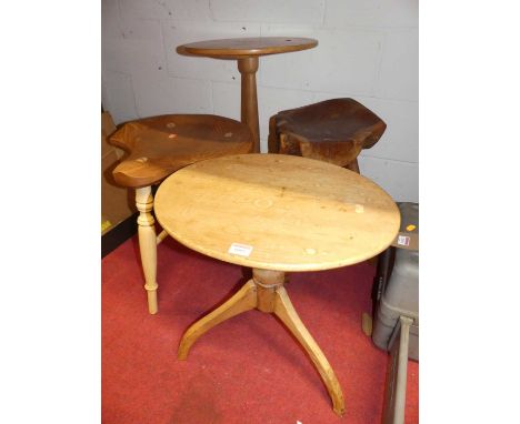 An antique pine low tripod table; together with a blond oak tripod table; a contemporary elm seat stool; and one other (4)