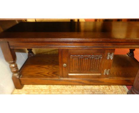 A contemporary Old Charm moulded oak rectangular two-tier coffee table, with single cupboard door, length 122cm