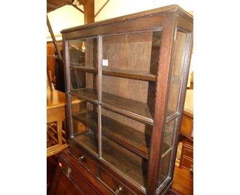 A 19th century mahogany table top single door glazed curiosity display cabinet, having twin short lower drawers, width 62cm