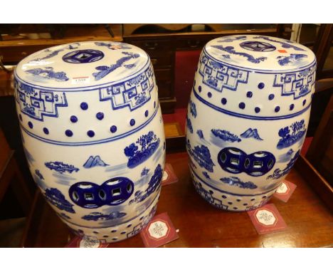 A pair of contemporary Chinese style blue &amp; white glazed ceramic barrel garden seats, each height 45.5cm