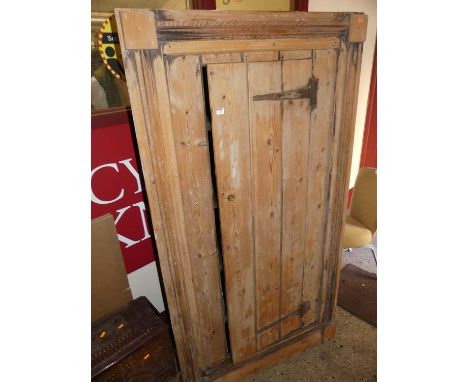 A rustic pine single door freestanding corner cupboard, with integral inner shelving, 188 x 103cm 