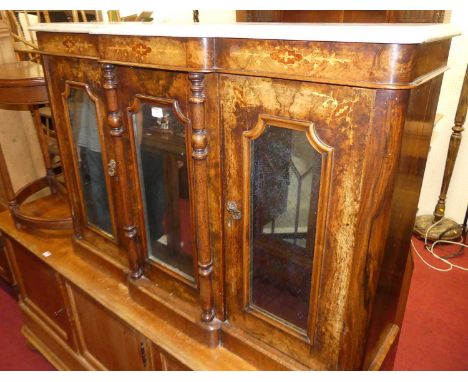 A mid-Victorian figured walnut and floral satinwood inlaid round cornered breakfront three door side cabinet, having white va