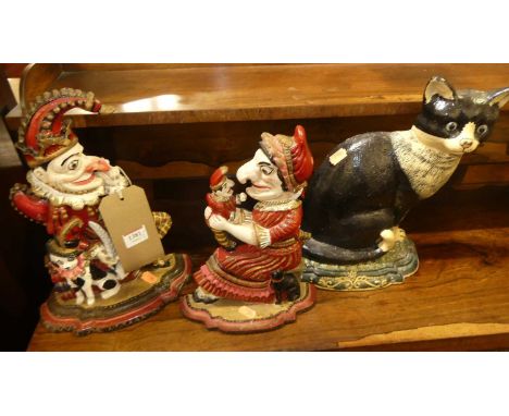 Three various reproduction painted cast iron door stops