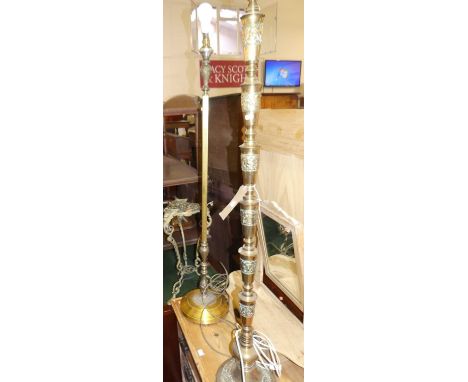 An Eastern brass standard lamp, together with a further twin branch brass standard lamp (2)