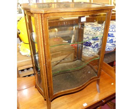 An Edwardian mahogany and chequer strung shaped single door low display cabinet with inset glass shelves, width 56cm