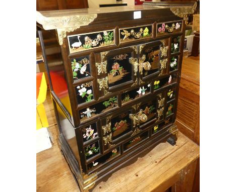 A contemporary Eastern stained elm, painted, gilt decorated and brass applied low side cabinet, fitted with three short drawe