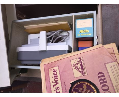 An Aldis projector and 2 bakelite records 
