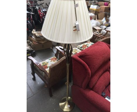 A modern brass effect standard lamp 