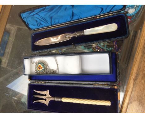 Silver bladed boxes knife, boxed fork and a pendant 