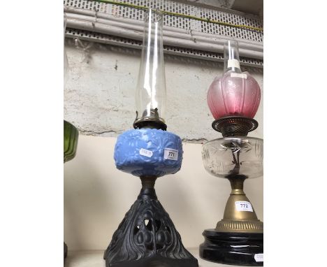 Cast base and blue glass oil lamp with funnel 