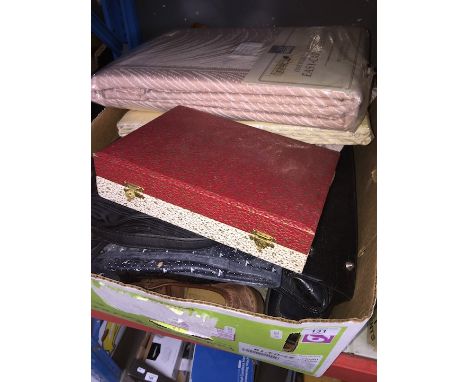 A box of handbags, boxed curtains, EPNS set, etc 