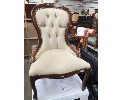 A button back nursing chair 