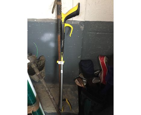 A hickory shafted golf putter and a little pick tool 