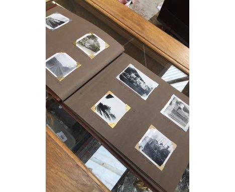 A vintage photo album containing mainly railway memorabilia, some with people, places, etc 