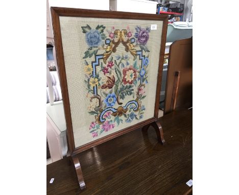 A tapestry fire screen 