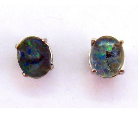 A pair of opal doublet ear studs, mounted in white metal (tests 14 carat gold), 1.2gms 