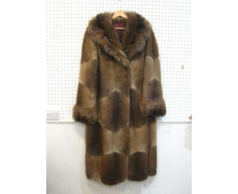 A full length light brown American marmot fur coat, size medium 