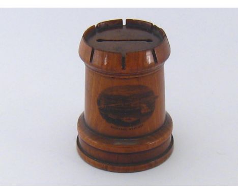A Scottish Mauchline ware treen moneybox in the form of a castle with print of Rothesay West Bay. 
