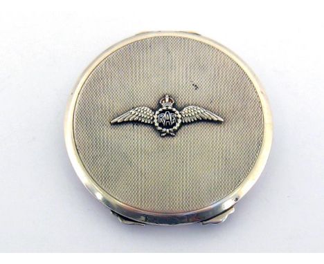 A WWII engine-turned circular silver compact applied with part-enamelled badge of the Royal Air Force, by Adie Brothers Ltd.,