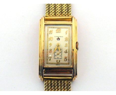 Longines, a 1940s 14 carat gold manual wind wristwatch, the convex rectangular case with stepped bezel, the silvered dial sig