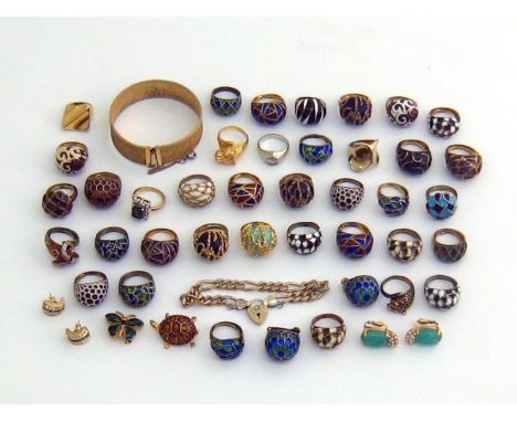 A mixed lot of gilt metal and enamel jewellery, including rings of bombe design, brooches, a bangle and ear clips 