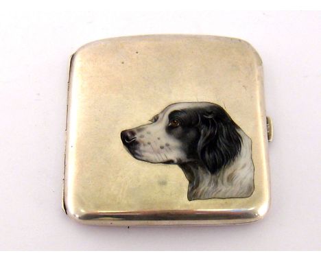 A German silver cigarette case, maker's mark a monogram SCD in a circle, cover enamelled with a black and white spaniel, gilt