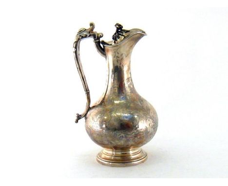 A Victorian silver ewer by J. Sherwood &amp; Sons, Birmingham, 1862, baluster form engraved with foliate scrolls around a vac