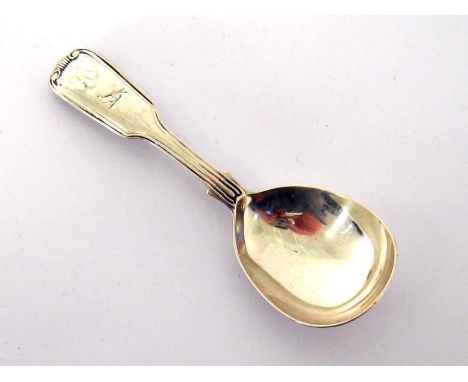 A Victorian silver fiddle, thread and shell caddy spoon with martlet crest, by Elizabeth Eaton, London, 1853, 11.1 cm. long, 