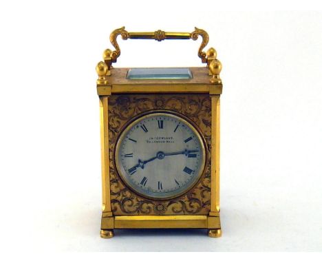 James Gowland. A fine large gilt brass cased carriage style mantel clock by James Gowland, 32, London Wall, with canted corne