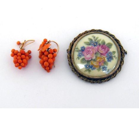 A pair of late 19th century coral earrings, each modelled as a bunch of grapes with vine, 3cm long, with 15 carat gold hook f