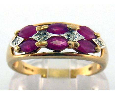 A 9 carat gold, ruby and diamond ring, set with six marquise cut rubies, small eight-cut diamond accents between, the shank f