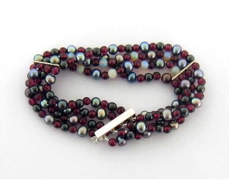 A four strand garnet, opal, black keshi pearl and haematite bracelet, composed of alternate polished and round stones, with o