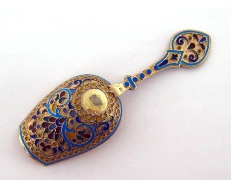 A Russian silver-gilt, plique-a-jour and cloisonné enamel shovel bowl caddy spoon by Antip Kuzmichev, "88" standard, Moscow, 