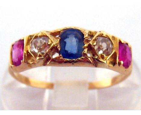 A late 19th century sapphire, ruby and diamond five stone ring, set with a central mixed cut 4.2mm sapphire between two old c