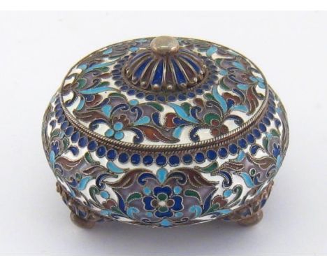 A small silver and cloisonne enamel covered pot bearing spurious Russian marks, squat circular on three fluted feet terminati